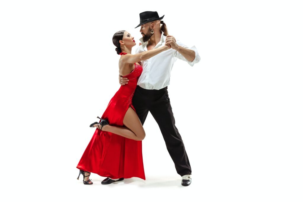 Portrait of young elegance tango dancers. Isolated over white background